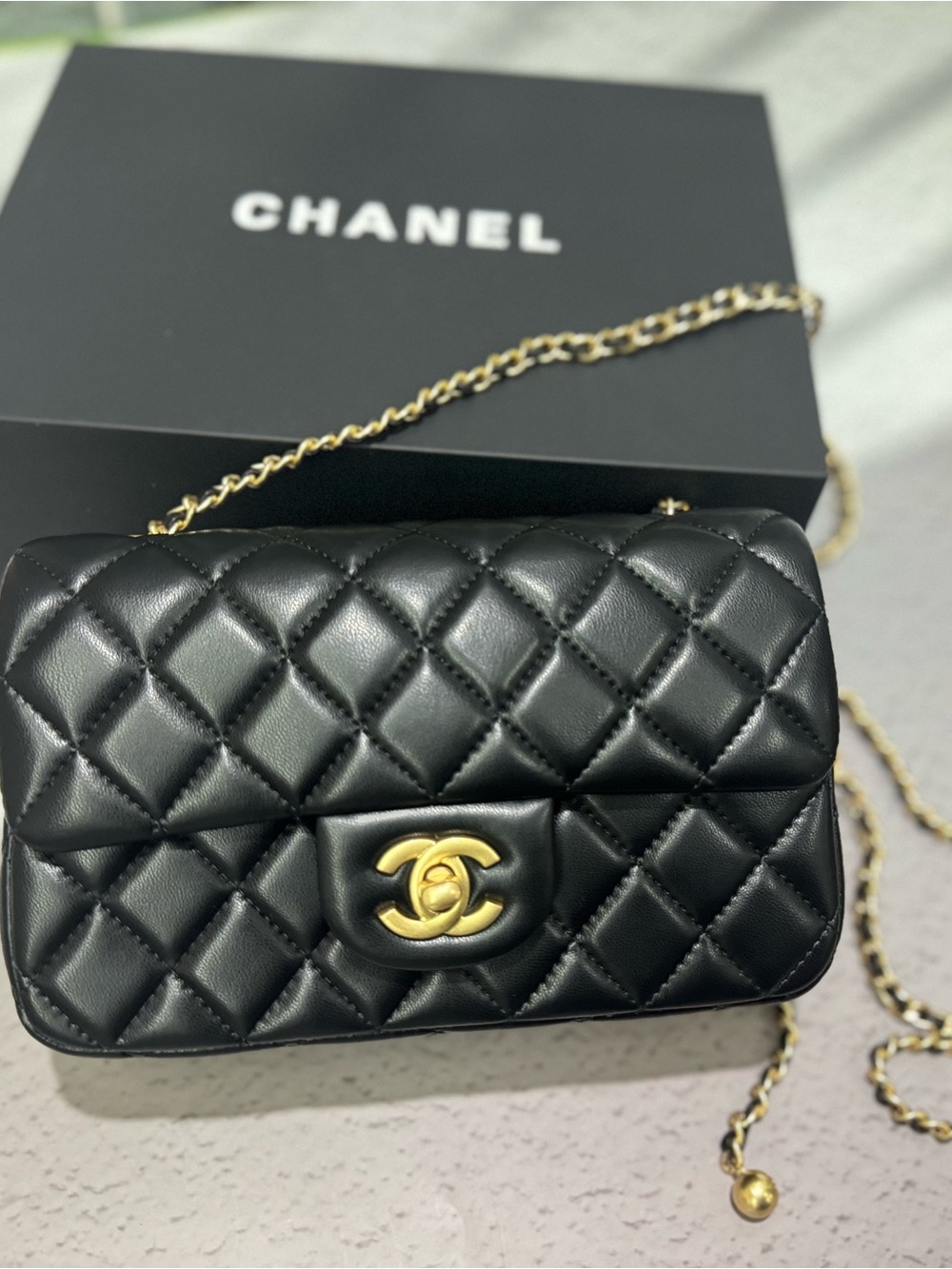 CHANEL Black Quilted Mini Crossbody with Gold Chain